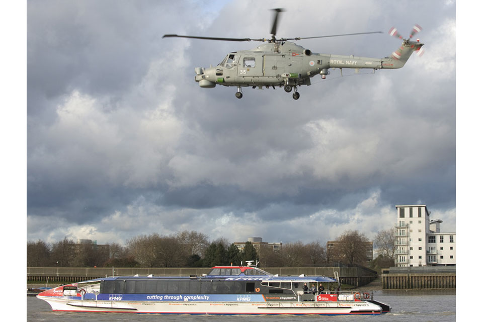 A Royal Navy Lynx helicopter hovers over a 'suspect ferry' 