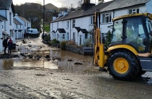 Picture of flood recovery action in Braithwaite.