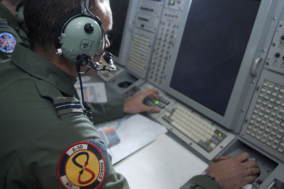 Crew members onboard an RAF E-3D Sentry aircraft (stock image) 