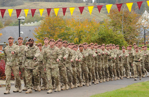 Soldiers from C Squadron of the King's Royal Hussars march into Aliwal Barracks on Tidworth Camp
