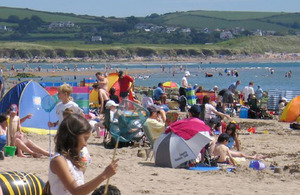 Sunny beach with people