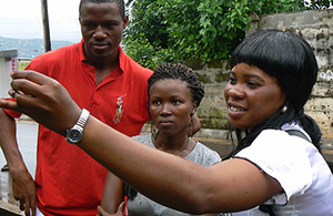 An Oxfam public health advisor checks water quality in Freetown, Sierra Leone. Picture: Oxfam