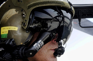 Army Air Corps pilot Captain Antony 'Thomo' Thompson in the cockpit of his Apache helicopter in Helmand province, Afghanistan