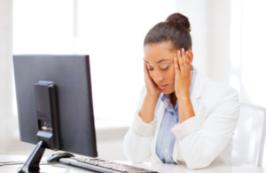 Woman stressed at computer