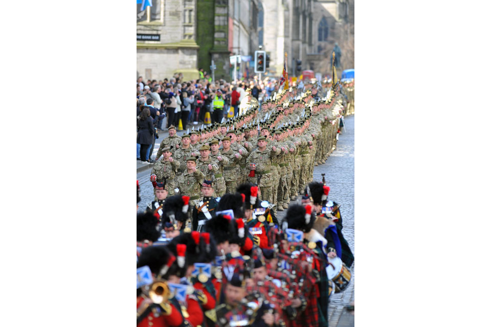 Soldiers march down the Royal Mile