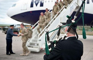 Group Captain Ian Gale greets members of 617 Squadron on their return to RAF Lossiemouth