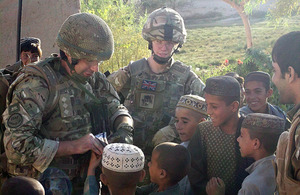 Captain Giles Walsh makes friends with local Afghan children
