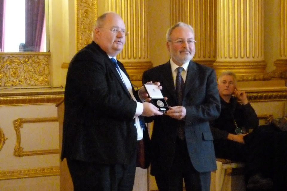 Eric Pickles presents the medal to Dr Jeremy Schonfield