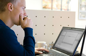 Man looking at a laptop