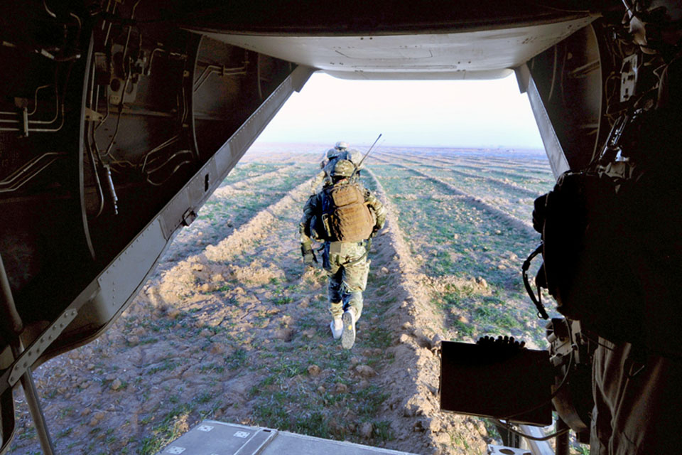Members of II Squadron RAF Regiment and the US Marine Corps exit a US Osprey aircraft during Operation DISHATA PASHA  