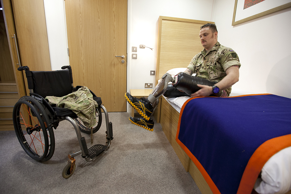 Sapper Clive Smith demonstrates his prosthetic lower limbs