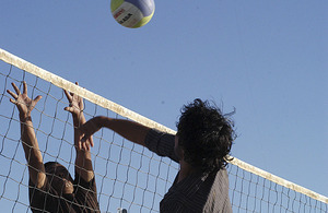 An Afghan soldier faces up to the net against a soldier from the Royal Gurkha Rifles during the first Babaji volleyball tournament at Patrol Base Nahidullah