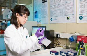 An image of a scientist carrying out qPCR DNA sequence testing