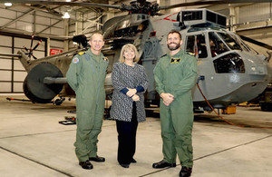 Defence Minister Harriett Baldwin at the 849 Naval Air Squadron hangar in front of a Sea King helicopter. Crown Copyright.