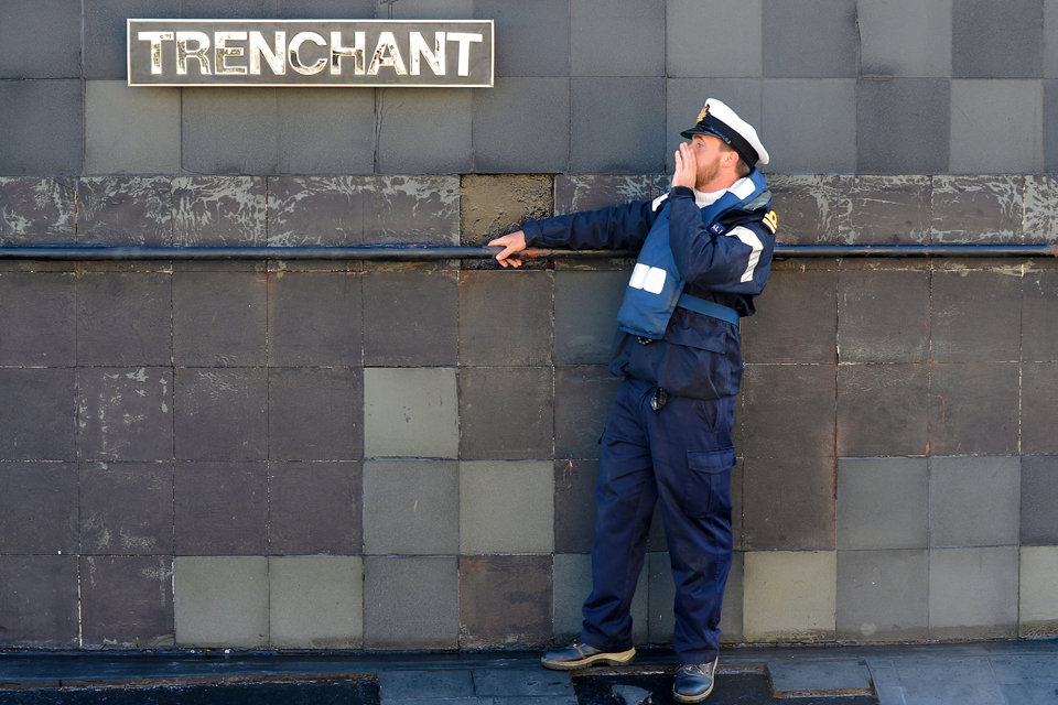 A submariner by HMS Trenchant's fin