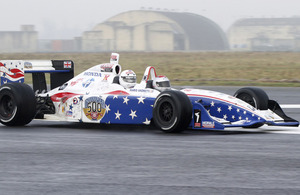 A lucky member of the personnel serving at RAF Honington is taken for a spin by Mario Andretti