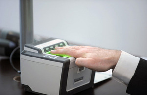 Image of person submitting biometric information.
