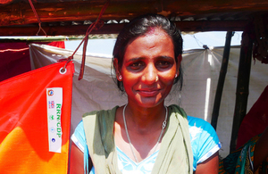 A women outside her temporary shelter provided by UK aid in Sunsari district Nepal