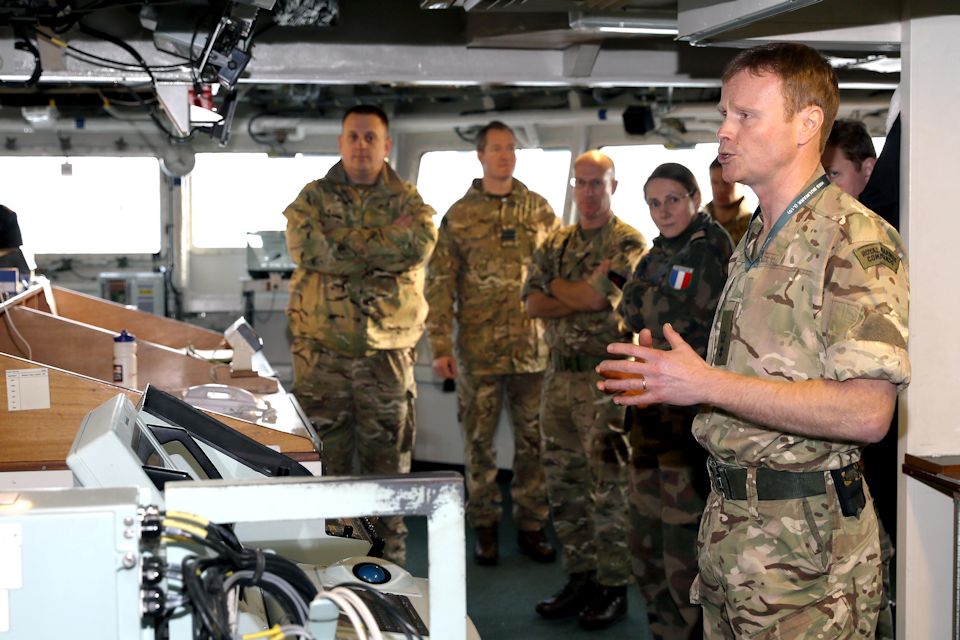 Lt Col James Fuller, RM, briefs SJFHQ personnel on the capabilities of HMS Bulwark. Crown Copyright/MOD 2017. All rights reserved