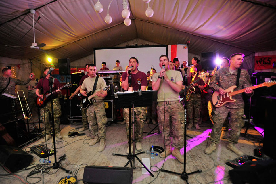 The Band of The Parachute Regiment performing as 'Ripcord' in a 'Battle of the Bands' at the 'Dutch Corner' (Dutch welfare facility) in Kandahar 