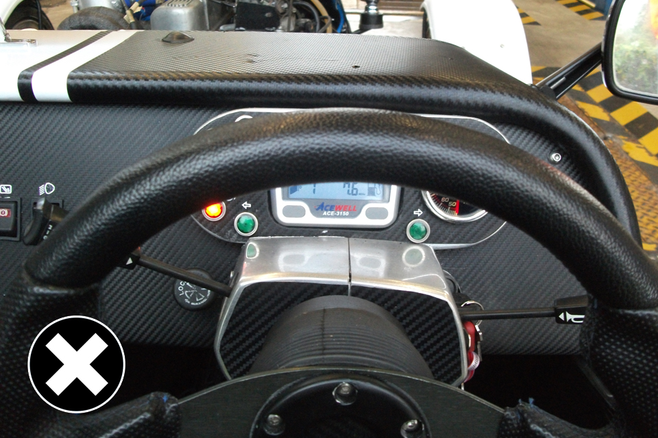 Now allowed: view of speedometer hidden from the driver.