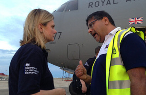 Justine Greening is greeted by UK Ambassador to the Philippines Asif Ahmad at Cebu airport during a visit to see how the UK is helping those affected by Typhoon Haiyan. Picture: Russell Watkins/DFID
