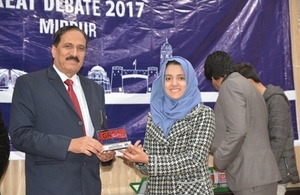 Great debate winner, Afifa Awais receiving award