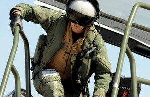 An RAF Typhoon pilot climbs out of his cockpit after completing a mission over Libya