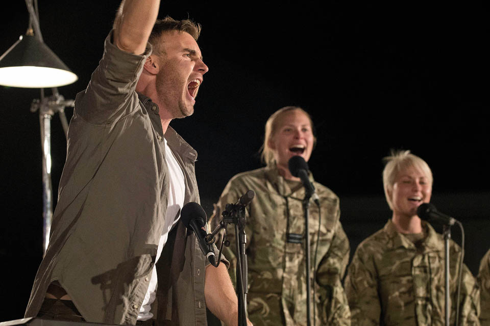 Gary on stage with members of the Armed Forces as his backing group