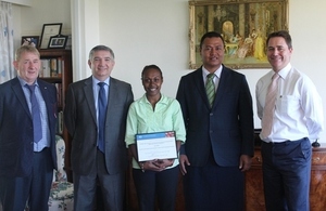 Janice Mose displaying her Chevening certificate with Foreign Affairs Minister Clay Forau, British High Commissioner Dominic Meiklejohn (on her left) and Colin Barratt, Simon Gore (on her right).