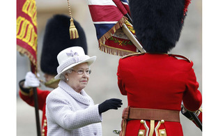 Her Majesty The Queen presents new Colours to the Coldstream Guards at Windsor Castle [Picture: Andrew Winning/PA Wire 2012]