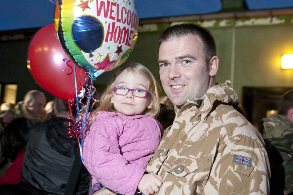 Flight Lieutenant Webster is welcomed home by his daughter