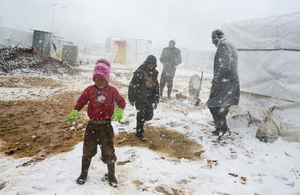 Syrian refugees brave the cold during heavy snowfall at the Terbol tented settlement in the Bekaa Valley last week. Picture: UNHCR/A. McConnell