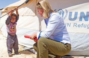 Photograph of Development Secretary Justine Greening and Syrian refugee