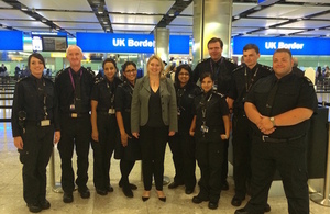 Karen Bradley with Border Force officers at Heathrow