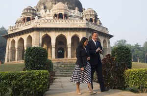 David Cameron walks with Priti Patel through the Lodhi Gardens in Delhi.