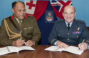 Brigadier General Tau'aika 'Uta'atu, Commander of the Tonga Defence Services, and Air Marshal Sir Stuart Peach, Chief of Joint Operations, sign the memorandum of understanding committing Tongan troops to ISAF's campaign in Afghanistan