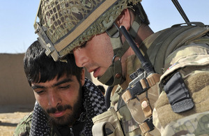 A British soldier from 2nd Battalion The Parachute Regiment and a member of the Afghan National Army plot a patrol route in northern Nad 'Ali (stock image)