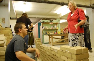 Baroness Hanham speaking to a construction trainee