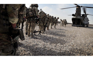 Troops board a Chinook at Camp Bastion