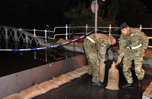 Soldiers from 2nd Signal Regiment assist the flood relief effort in North Yorkshire in the early hours of Thursday 27 September