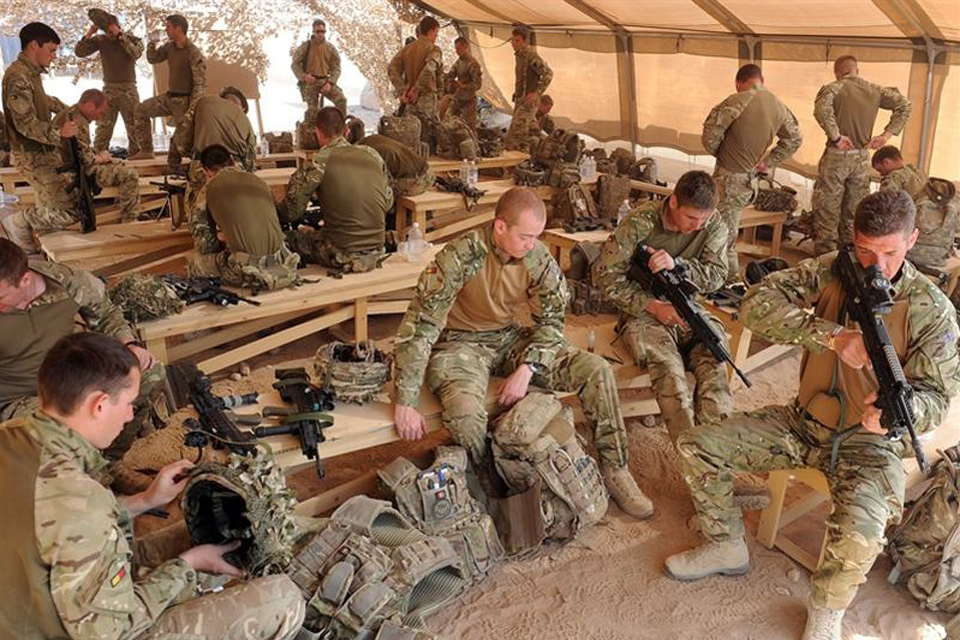 Soldiers from 1st Battalion The Royal Anglian Regiment cleaning their weapons