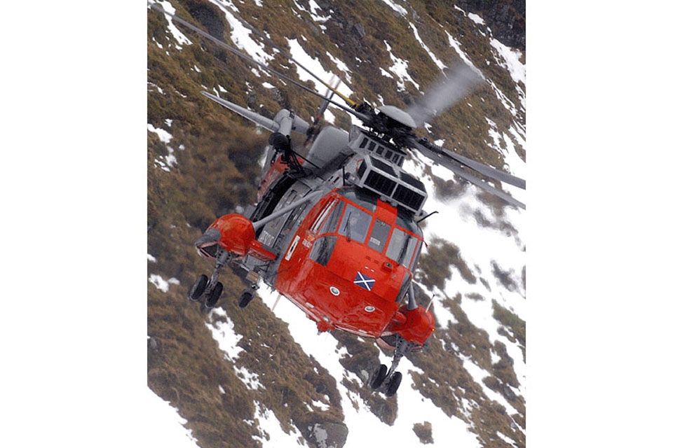 HMS Gannet's Sea King Search and Rescue helicopter in flight above the Scottish Highlands 