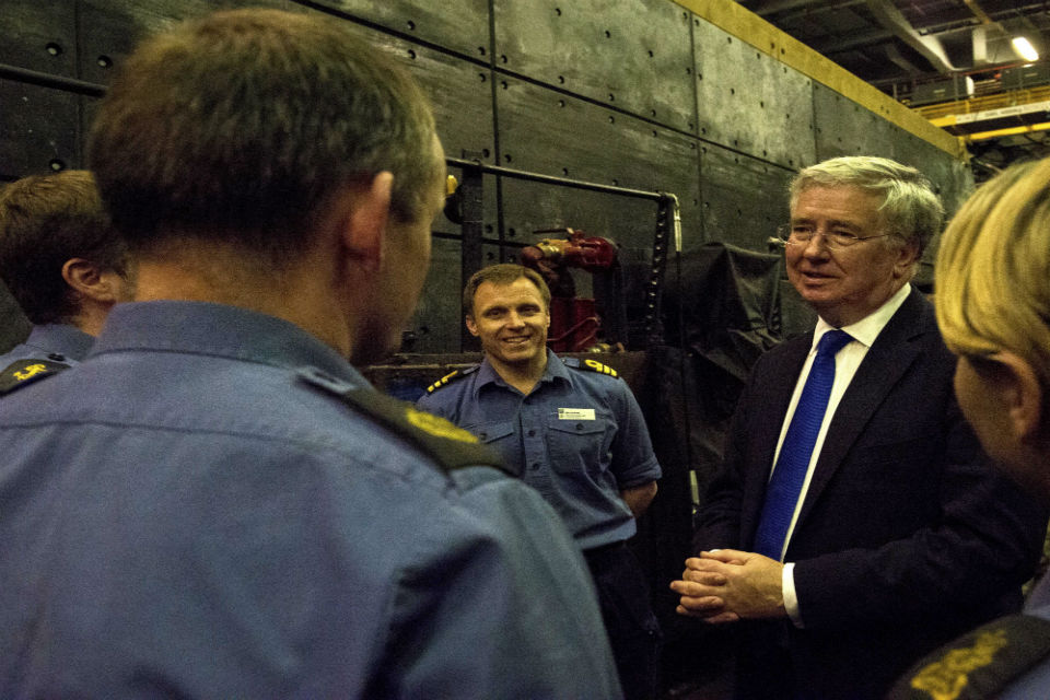 Michael Fallon speaks to the crew on board HMS Bulwark