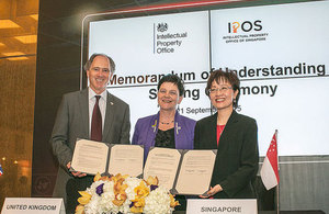 Image of Scott Wightman, Baroness Neville Rolf and IPOS with the signed agreement.