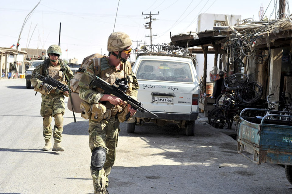 A patrol by the 40 Commando Police Mentoring Troop from Forward Operating Base Jackson in Sangin 