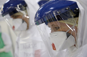 NHS medics in protective suits prepare for deployment to Sierra Leone. Picture: Simon Davis/DFID