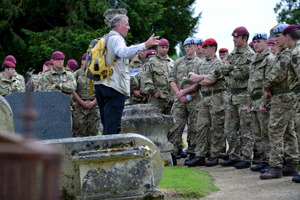 Paratroopers at a cemetery in Breville