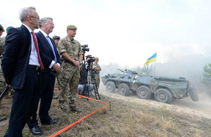 Defence Secretary Michael Fallon observes Ukrainian soldiers demonstrating skills learned from UK training teams