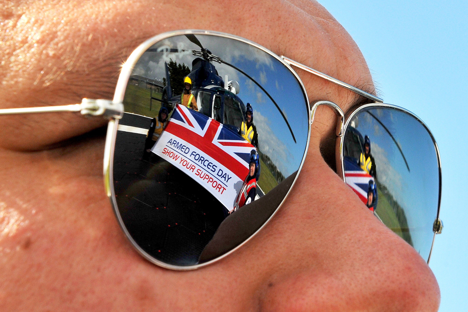 Members of the Flag Officer Sea Training aviation department refelected in a pair of sunglasses